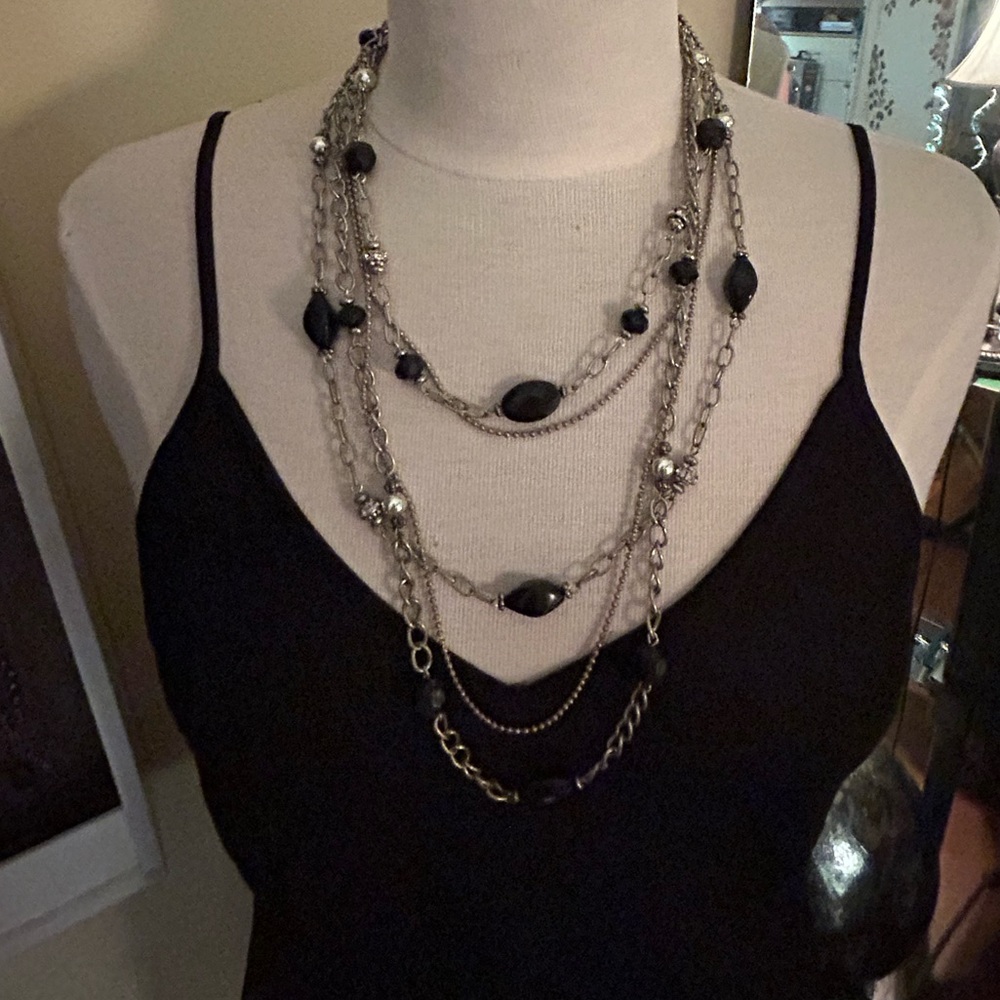 Mid length silver & black charmed necklace